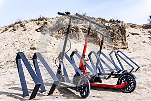 scooters parked on the beach parking lot in summer, eco-friendly