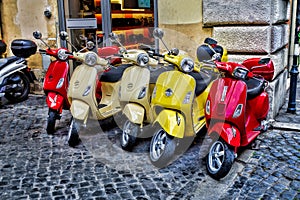 Scooters are parked on the city street in Rome, Italy photo