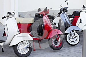Scooters white, red and blue