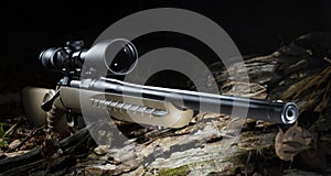 Scope on a bolt action hunting rifle in a dark woodland