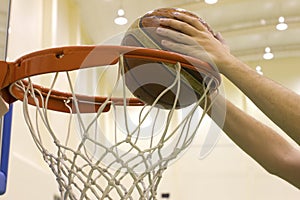 Scoring basket in basketball court