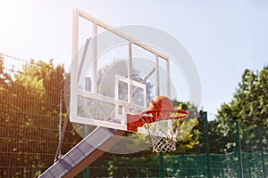 Scoring winning point during basketball game at outdoor court, empty space