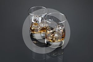 Scotch or bourbon filled glass tumblers