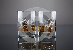 Scotch or bourbon filled glass tumblers photo