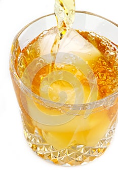 Scotch on the rocks being poured