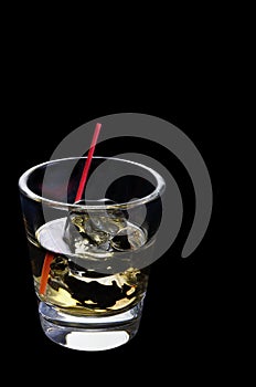 Scotch on the rocks on a black background photo