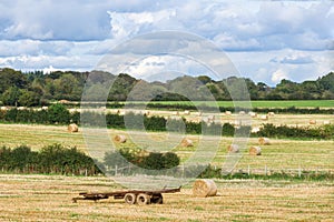 Scotland`s Ayrshire Farmlands With Farmers Trailer and hay Bales