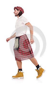 Scotsman in movement isolated on white