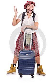 Scotsman with suitcase isolated on white