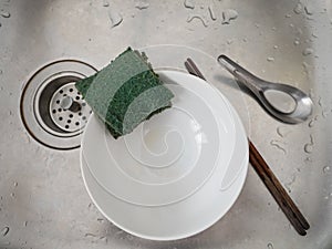 Scott bright, bowl, chopsticks and spoon in sink