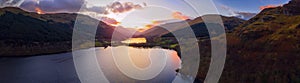 Scottish beautiful colorful sunset landscape with Loch Voil, mountains and forest at Loch Lomond & The Trossachs National Park