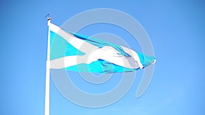 Scottish blue white cross flag blowing in wind slow motion in Scotland