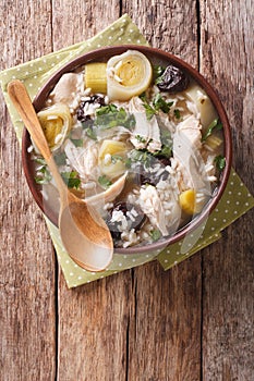 Scottish cock-a-leekie soup with leeks and prunes close up in a