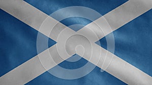 Scottish flag waving in the wind. Close up of Scotland banner blowing soft silk