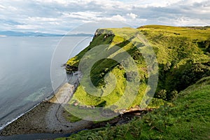 Scottish landscape with hills and shoreline near Staffin at Isle of Skye near the ruins of diatomite factory