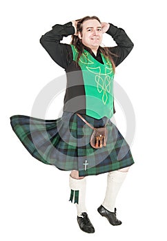 Scottish man in traditional national costume with blowing kilt