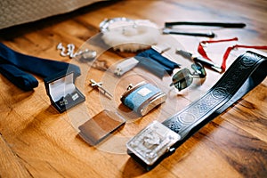 Scottish men`s traditional accessories sporran, pocket watch on a chain, tie, cufflinks, cross, belt, knife, flask