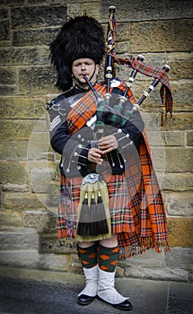 Scottish piper dressed in his kilt