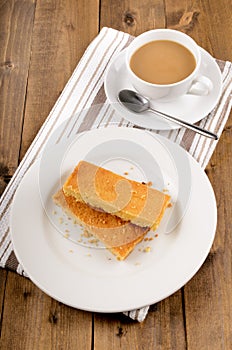 Scottish shortbread on a plate and cup of black tea