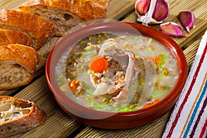 Scottish soup with lamb, vegetables, pulses, barley in clayware