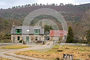 Scottish stone home with a mountain in the background