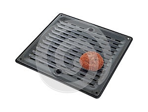 Scouring pad on broiler pan photo