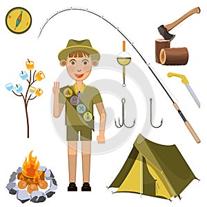 Scout boy with hand honor sign near camp equipment set