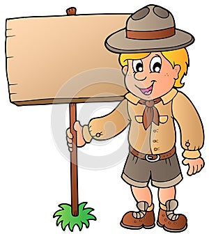 Scout boy holding wooden board