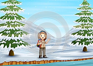 Scout girl exploring in winter landscape