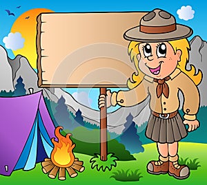 Scout girl holding board outdoor