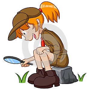 Scout girl sitting with holding magnifying glass
