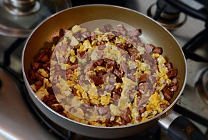 Scrambled eggs cooking in a pan