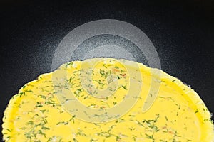 Scrambled eggs with dill cooking
