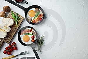 Scrambled eggs in frying pan with pork lard, bread and green feathers in cast iron frying pan, on white background, top view flat