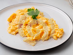 Scrambled eggs, Omelette. Breakfast with pan-fried eggs, cup of