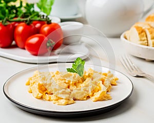 Scrambled eggs, Omelette. Breakfast with pan-fried eggs, cup of