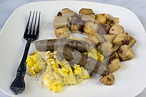 Scrambled eggs sausage and home fries