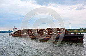 Scrap metal on a barge on a river in Germany