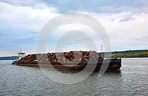 Scrap metal on a barge on a river in Germany