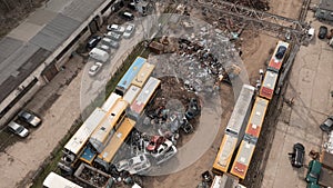 Scrap Metal Junkyard With Working Excavator