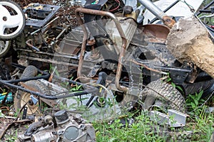 Scrap metal pile withg mowers and engines