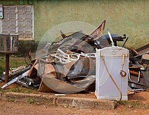 Scrap Metal for sale piled up in front of a local residents house