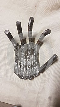 scrap metal sculpture metal recycling hand 2