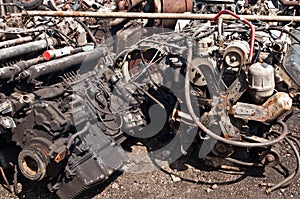 Scrap with old electric and fuel motors on scrap heap ready for dismounting and recycling