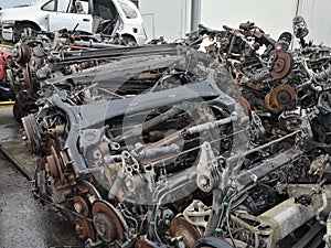 The scrap yard engine and cars parts.