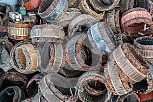 scrap yard of stator plate and wingdings in ac alternators for recycling.