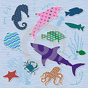 Scrapbook elements. Fish with patterns on blue background.