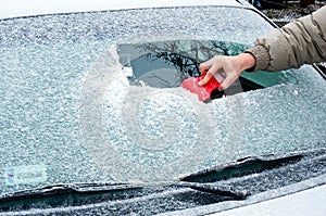 Scraping frozen windshield