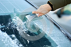 Scraping Ice Off the Windshield