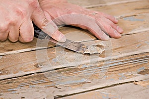 Scraping paint on a deck